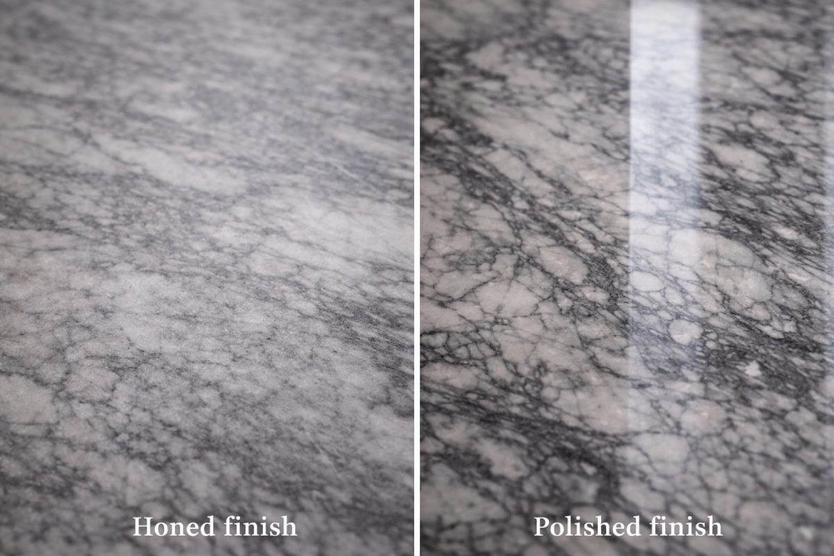 Close-up of honed Arabescato Grigio marble finish showing soft, low-gloss reflection.