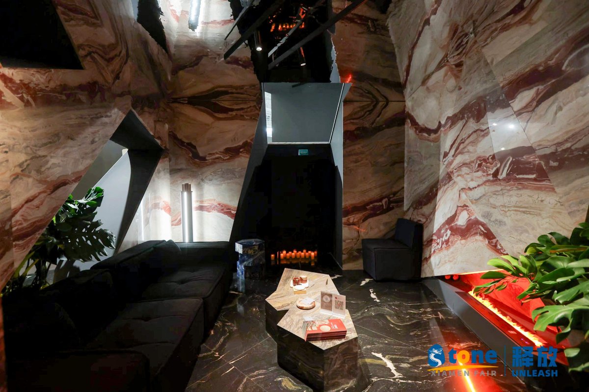 Orobico Rosso marble showcased in an immersive booth space at Xiamen Stone Fair 2025